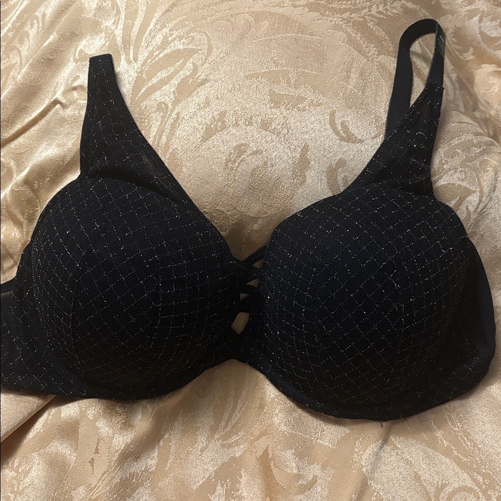 Black Bra with Sparkley Gold Pattern. Adustable & Criss-crossable straps.